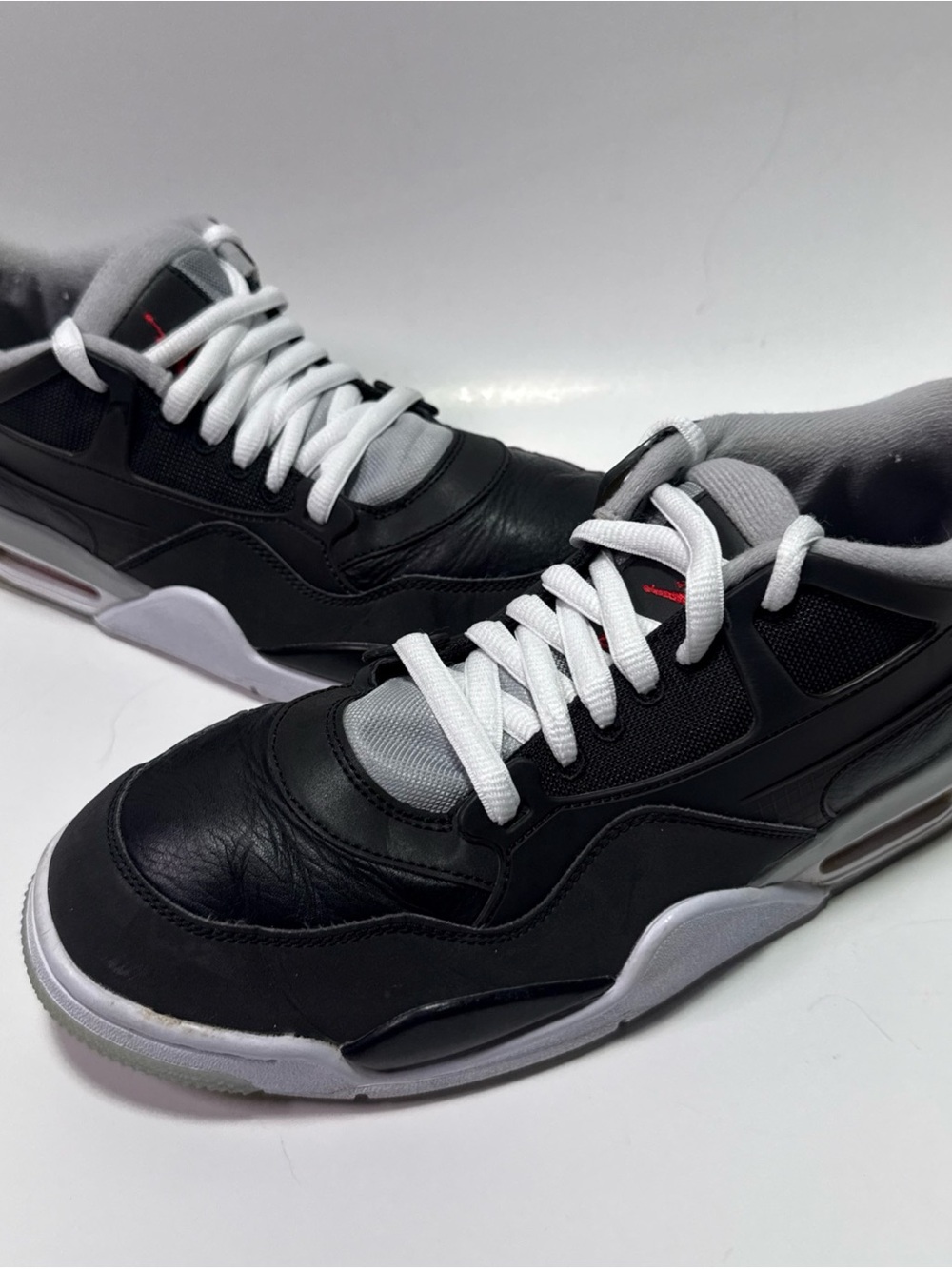 Jordan Black and White Low Profile Sneakers with Red Accent